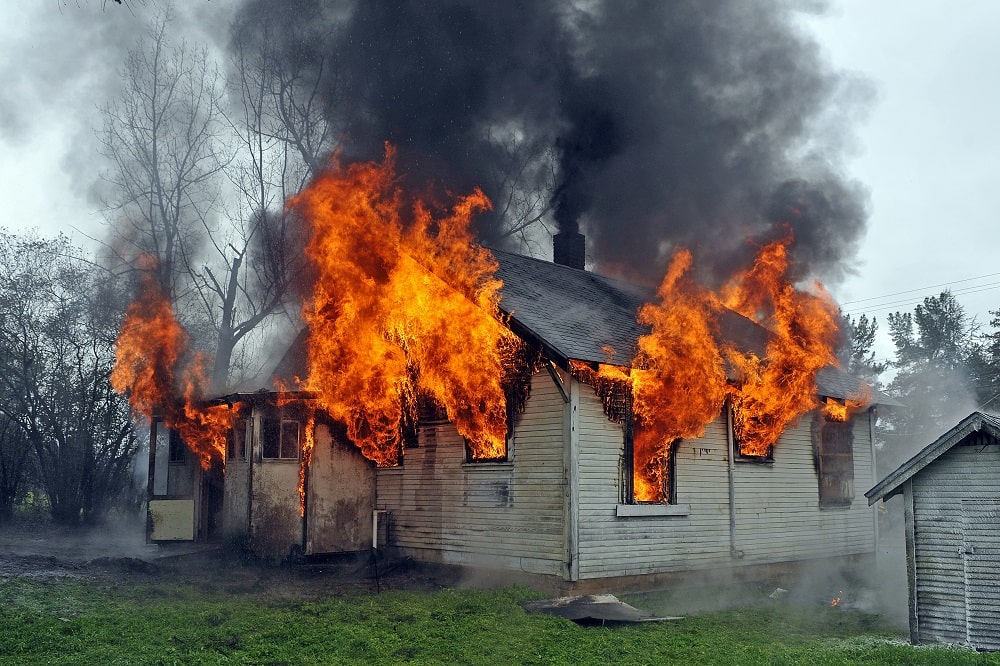 House engulfed in flames and smoke ready for Fire Damage Restoration